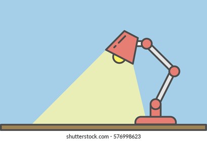 Lamp on the table. Simple red lamp stands on the table. Concept of learning and working at home or at the office.