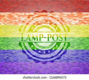 Lamp-post emblem on mosaic background with the colors of the LGBT flag