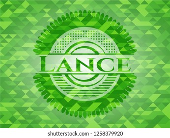 Lance green emblem with mosaic background