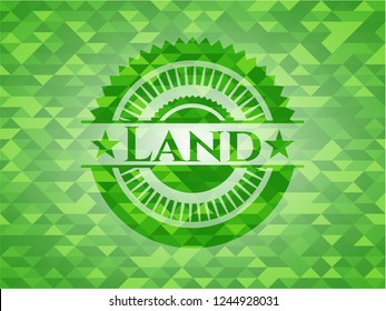 Land green emblem. Mosaic background