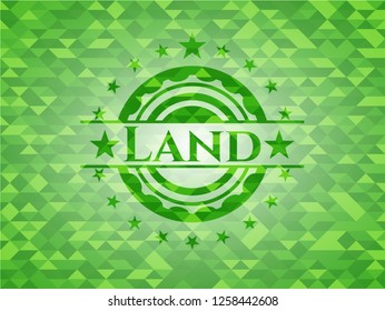 Land green emblem. Mosaic background