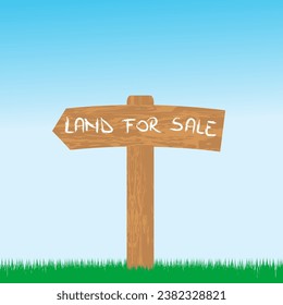 Land for sale wooden sign in a green area. Field for construction