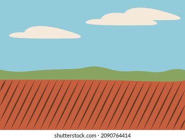 Paisaje de campos cultivados y montañas.