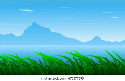 Landscape of grass against the background of the river and mountains
