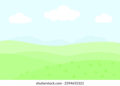 Landscape with green field and grass, blue sky, white clouds.