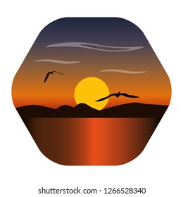 Landscape image of a sunset, the dawn sun over the mountains in the background and clouds above. Flying seagull silhouettes. Seascape with reflection in water. Concept of peace, travel and holiday.