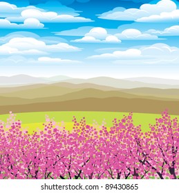 Landscape with pink japanese trees and mountains on a blue cloudy sky