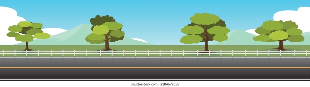 Landscape view of asphalt road.  Background of trees and green grass and mountain. Under the blue sky.