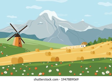 Landscape wheat fields with mill wheat stacks and mountains.