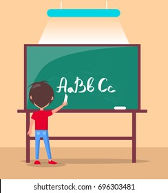 Language class in primary school banner. Boy studies alphabet at lesson, pupil writes ABC on blackboard by chalk in classroom