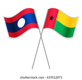 Laotian and Bissau-Guinean crossed flags. Laos combined with Guinea-Bissau isolated on white. Language learning, international business or travel concept.