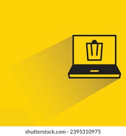 laptop and bin icon with shadow on yellow background