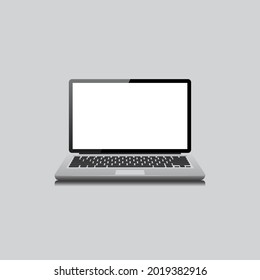Laptop with blank screen on gray background. Laptop front view.