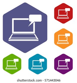 Laptop with bubble speech icons set rhombus in different colors isolated on white background