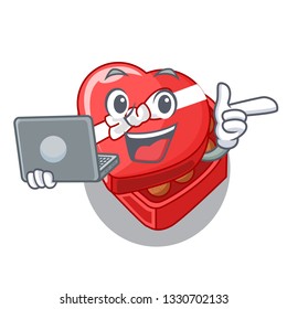 With laptop chocolate box heart above cartoon table