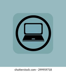 Laptop in circle, in square, on pale blue background
