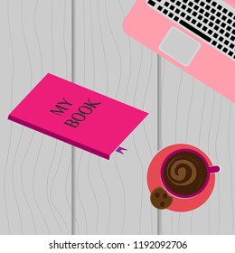 Laptop and coffee cup on a wooden background