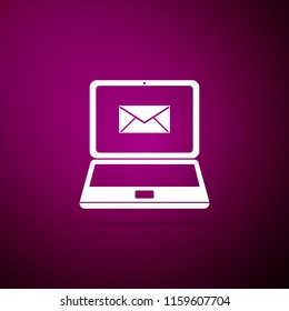 Laptop with envelope and open email on screen icon isolated on purple background. Email marketing, internet advertising concepts. Flat design. Vector Illustration
