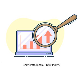 Laptop with growing graph on it, magnifying glass on screen.