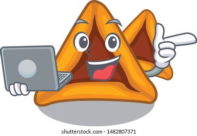 With laptop hamantaschen cookies served in cartoon jar
