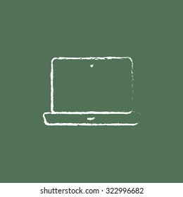 Laptop hand drawn in chalk on a blackboard vector white icon isolated on a green background.