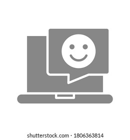 Laptop with happy face in chat bubble gray icon. Customer satisfaction symbol.