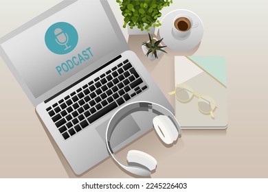 Laptop with headphones, notebook, eyeglasses and cup of coffee o