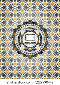 laptop icon inside arabic badge. Arabesque decoration.
