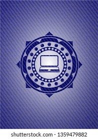 laptop icon inside badge with jean texture