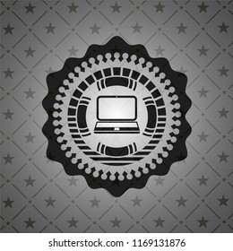 laptop icon inside black badge