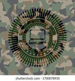 laptop icon inside camo texture