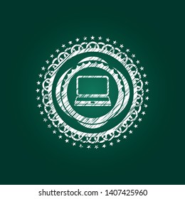 laptop icon inside chalkboard emblem on black board