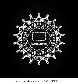 laptop icon inside chalkboard emblem. 