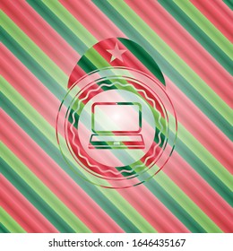 laptop icon inside christmas colors style badge.