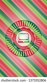 laptop icon inside christmas style badge..