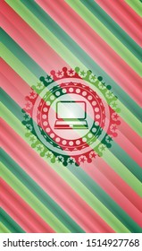 laptop icon inside christmas style emblem.