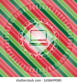 laptop icon inside christmas style badge..