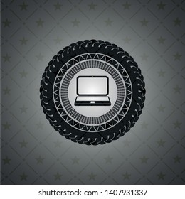 laptop icon inside dark badge