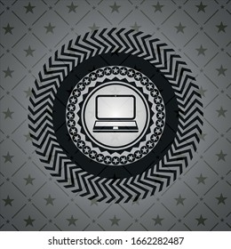 laptop icon inside dark badge