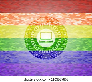laptop icon inside emblem on mosaic background with the colors of the LGBT flag