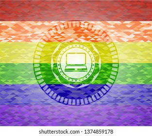 laptop icon inside emblem on mosaic background with the colors of the LGBT flag