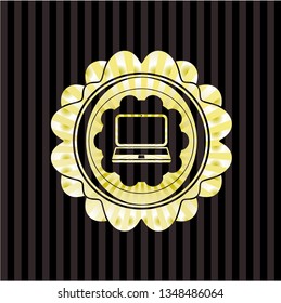 laptop icon inside gold emblem or badge