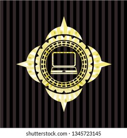laptop icon inside gold shiny badge