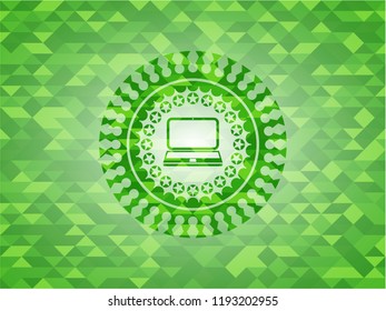 laptop icon inside green mosaic emblem