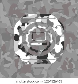 laptop icon inside grey camo emblem