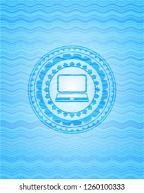 laptop icon inside light blue water emblem background.