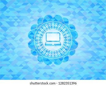 laptop icon inside light blue emblem with mosaic background