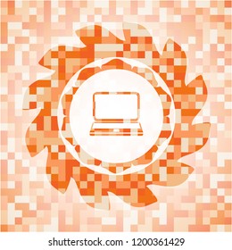 laptop icon inside orange mosaic emblem