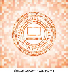 laptop icon inside orange mosaic emblem