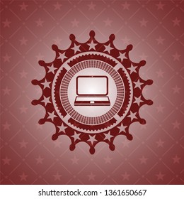 laptop icon inside red emblem